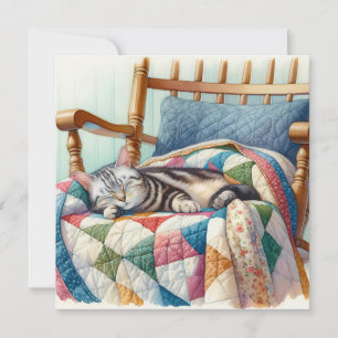 Sweet Gray Cat Sleeping on a Quilt