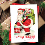 Sweet Jolly Santa Vintag Non-Foto-Ferienkarte<br><div class="desc">Diese süße Ferienkarte ohne Foto zeigt Vintag, wie der Weihnachtsmann mit einem Sack voller Spielzeuge auf einen Kamin klettert. Der Gruß auf der Vorderseite der Karte sagt "Happiest Holidays", ist aber editierbar und kann auf alles geändert werden, was Ihnen gefällt. Es gibt auch Platz für Ihre Namen und das Jahr....</div>