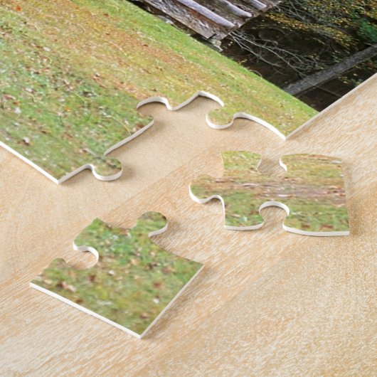 Szenen-historisches Blockhaus in rauchigem Puzzle (Seite)