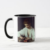 T31971 ein junger Junge, der Apple abzieht Tasse (Links)