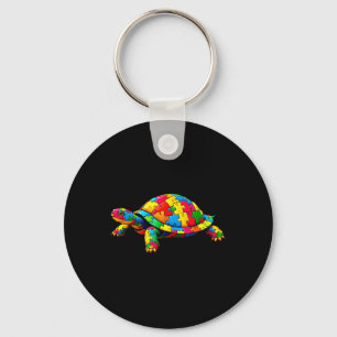 Tag des Autismus: niedliche Schildkröte und Puzzle Schlüsselanhänger