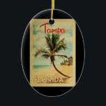 Tampa Palm Tree Vintage Travel Keramik Ornament<br><div class="desc">Ein einzigartig Retro Mitte des Jahrhunderts moderne Tampa Florida Kunstdruck in Vintage Reise Poster Stil. Es verfügt über eine geschwungene Palme am Sandstrand mit Ozean unter einem blauen bewölkten Himmel.</div>