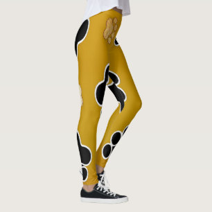 Tan and black paw print on gold background #2 leggings