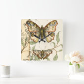 Tandem schlägt über grüne Blätter Quadratische Wanduhr (Zuhause)