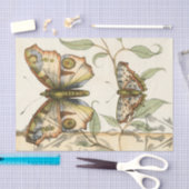 Tandem schlägt über grüne Blätter Seidenpapier (Handwerk)