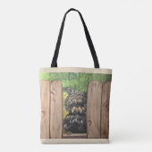 Tasche mit dem niedlichen Hund, der zwischen (Rückseite)