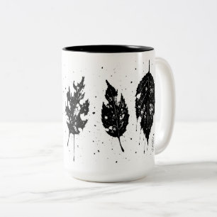 Tasche mit toten, tintenbedruckten Blättern Zweifarbige Tasse