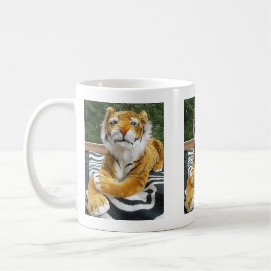 Tasse, angefüllter TIGER Kaffeetasse (Links)