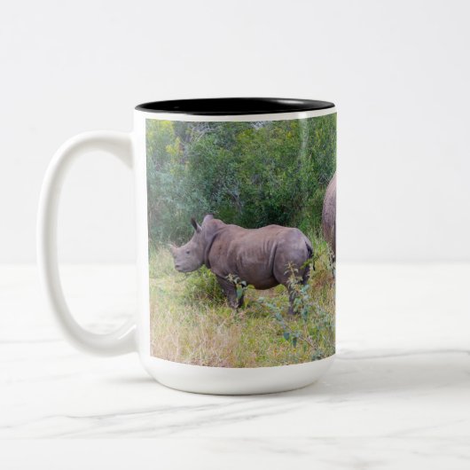 Tasse der Muttermilch und der gebleiblichen Rhino (Links)
