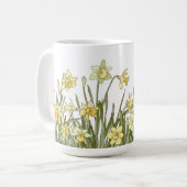 Tasse des Kaffees mit Blumenrand von gelben Narzis (Vorderseite Links)