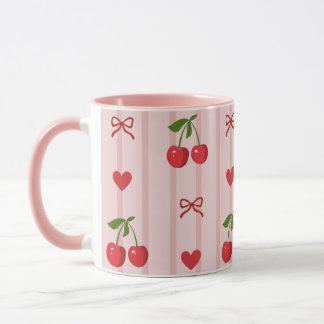Tasse mit roten Schleifen und Kirschen