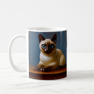Tasse mit siamesischer Katze mit blauen Augen