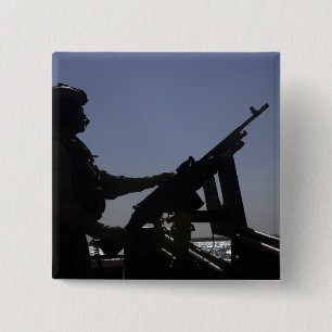 Techniker bemannt ein Maschinengewehr M240 im Irak Button