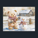 Teddy Bear Building a Snowman Postkarte<br><div class="desc">Charming watercolor illustration of a teddy bear creating a snowman in a winter wonderland,  capturing the joy of a snowy day. Ideal for seasonal greetings and childrens stories.</div>