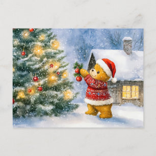 Teddy Bear Decorating a Christmas Tree in snowing Postkarte