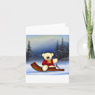 Teddybär auf einem Schlitten im Schnee Karte