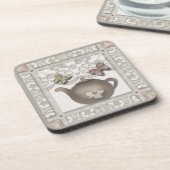 Teekanne aus Glas, beige Farben Getränkeuntersetzer (Linke Seite)