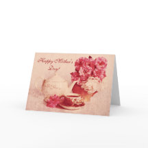 Teekanne, eine Tasse Tee und Rose