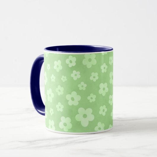 Teetasse mit blauem Griff, grün-weiße Blume (Vorderseite Links)