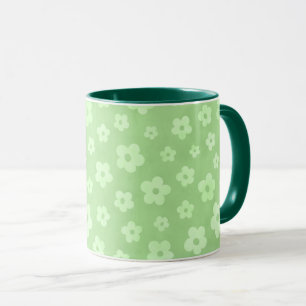 Teetasse mit grünem Griff und grüner Blume