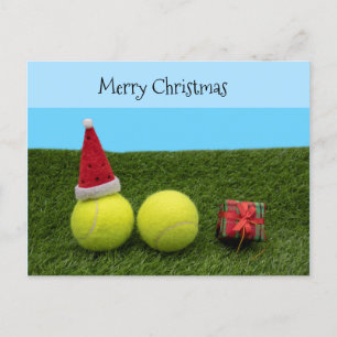 Tennis mit Merry Christmas Santa Hut auf grünem Feiertagspostkarte