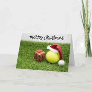 Tennisball mit Weihnachtsmannmütze Weihnachten