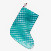 Textilverschluss im Hintergrund. Kleiner Weihnachtsstrumpf (Vorderansicht (hängend))