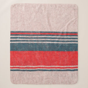 Textur aus Strickwaren mit roten Streifen  Sherpadecke