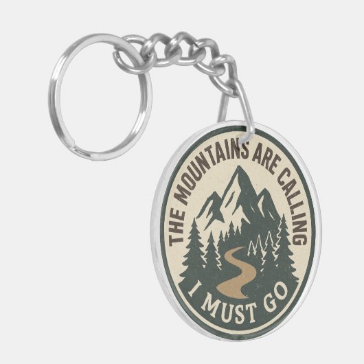 The Mountains Are Calling – Adventure Hiking Badge Schlüsselanhänger (Vorderseite links)