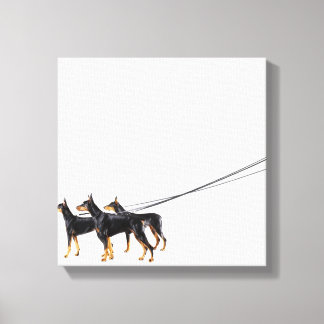 Three Dobermans on leash Leinwanddruck