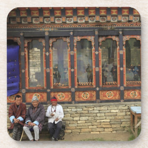 Three men sit on a bench at the Memorial Chorten Getränkeuntersetzer