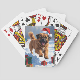 Tibetan Mastiff läuft mit Weihnachtsmut im Schnee Spielkarten