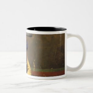 Tibetischer buddhistischer Mönch hebt einen Jungen Zweifarbige Tasse