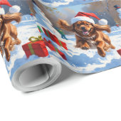 Tibetischer Spanier, der mit Weihnachtshut in Schn Geschenkpapier (Rolleneckpunkt)