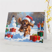 Tibetischer Spanier, der mit Weihnachtshut in Schn Karte (Gelbe Blume)