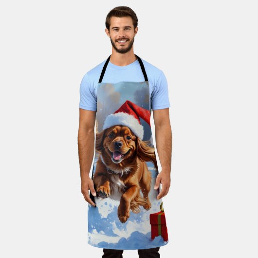 Tibetischer Spanier, der mit Weihnachtshut in Schn Schürze (Getragen)