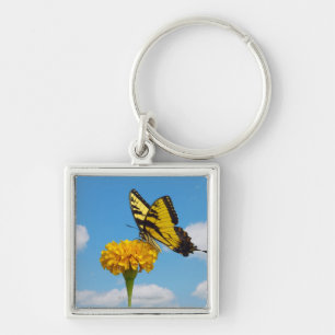 Tiger-Frack-Schmetterling auf einer Blume Schlüsselanhänger