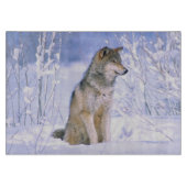 Timberwolf, der im Schnee sitzt, Canis Lupus, Schneidebrett (Vorderseite)