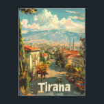 Tirana Vintag Postkarte<br><div class="desc">Eine lebendige und farbenprächtige Darstellung von Tirana, der Hauptstadt Albaniens, die eine Mischung aus historischer und moderner Architektur zeigt. Das Design besticht durch bemerkenswerte Sehenswürdigkeiten, belebte Straßen und lebhafte Stadtteile, die alle in nostalgischem Retro-Stil illustriert sind. Dieses Kunstwerk spiegelt den dynamischen Geist und den einzigartigen Charme Tiranas wider und lädt...</div>