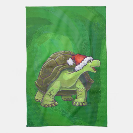 Tortoise in der Weihnachtsmannmütze auf grün Handtuch (Vertikal)