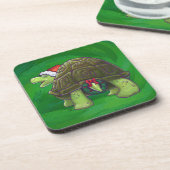 Tortoise in der Weihnachtsmannmütze auf grün Untersetzer (Linke Seite)