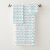 Towels with a light blue fish pattern hang neatly badhandtuch set
