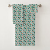 Towels with a teal floral pattern hang  badhandtuch set (Insitu)