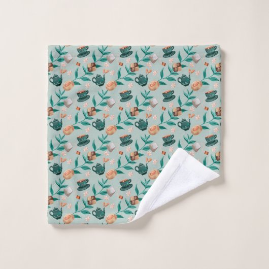 Towels with a teal floral pattern hang  badhandtuch set (Waschlappen)