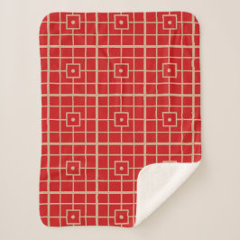 Traditionelles geometrisches Muster aus Rot und Go Sherpadecke