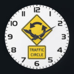 Traffic Circle Road Sign Yellow Diamond Große Wanduhr<br><div class="desc">Keep track of time with a modern industrial twist using this traffic circle road sign wall clock. This functional decor piece features the iconic yellow and black roundabout symbol as the clock face, making it a standout addition to a garage, man cave, office, or classroom. It is a thoughtful gift...</div>