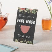 Tragen Sie bitte eine Gesichtsmaske für die Blumen Sockelschild (In SItu)