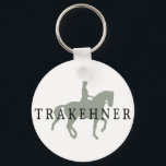 TRAKEHNER mit Dressurreiter Schlüsselanhänger<br><div class="desc">TRAKEHNER mit Dressurreiter & Reiter T - Shirt & Geschenken kennzeichnet unsere wunderschöne Piaffe Pferd und Reiter Silhouette mit TRAKEHNER Text. Die perfekte Geschenkidee für die Besitzer der Trakehner Pferdezucht, und die Leute, die zum Trakehners Reiten für die Dressur gehören. Zahlreiche Shirt-, T - Shirt- und Bekleidungsvarianten sowie Hüte, Aufkleber,...</div>