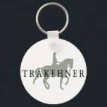 TRAKEHNER mit Dressurreiter Schlüsselanhänger<br><div class="desc">TRAKEHNER mit Dressurreiter & Reiter T - Shirt & Geschenken kennzeichnet unsere wunderschöne Piaffe Pferd und Reiter Silhouette mit TRAKEHNER Text. Die perfekte Geschenkidee für die Besitzer der Trakehner Pferdezucht, und die Leute, die zum Trakehners Reiten für die Dressur gehören. Zahlreiche Shirt-, T - Shirt- und Bekleidungsvarianten sowie Hüte, Aufkleber,...</div>