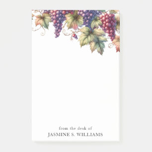 Trauben auf dem Wein vom Schreibtisch der Post-it Klebezettel